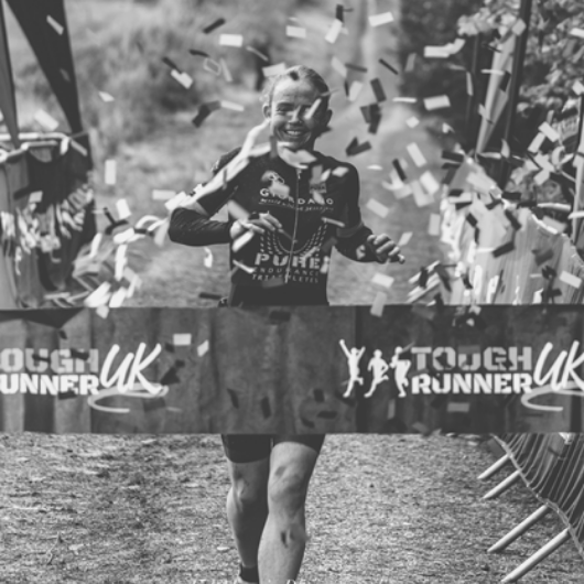 Kerri-Ann finishing a triathlon